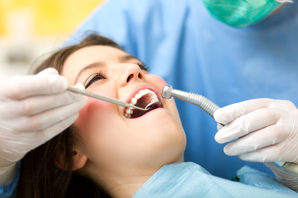 close up photo of a teen girl during a dental examination